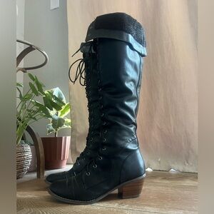 Women’s black lace up over the knee boots.